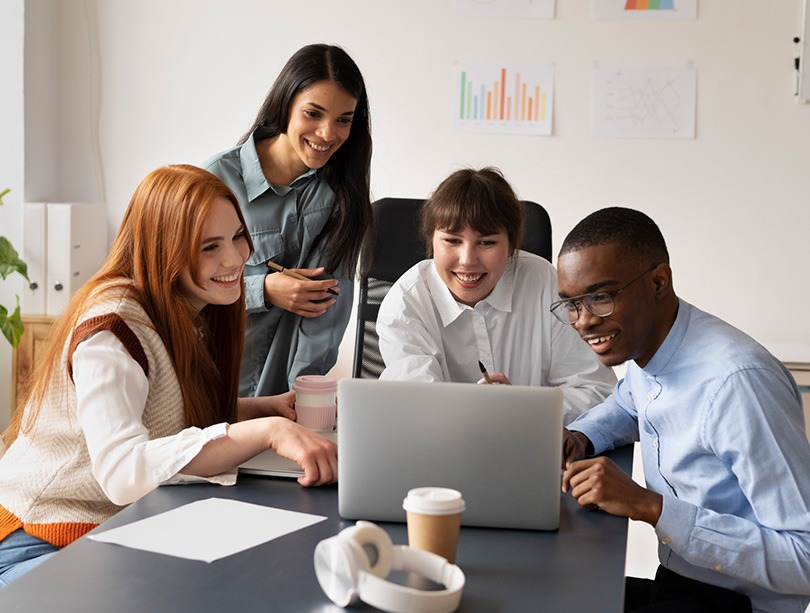 People Discussing in front of a laptop